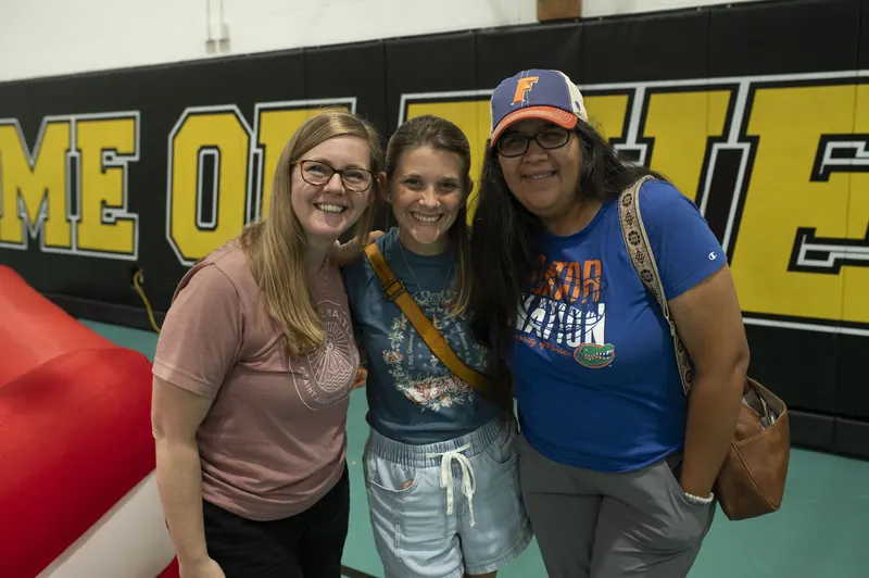 Three mothers of the parish together at a family event